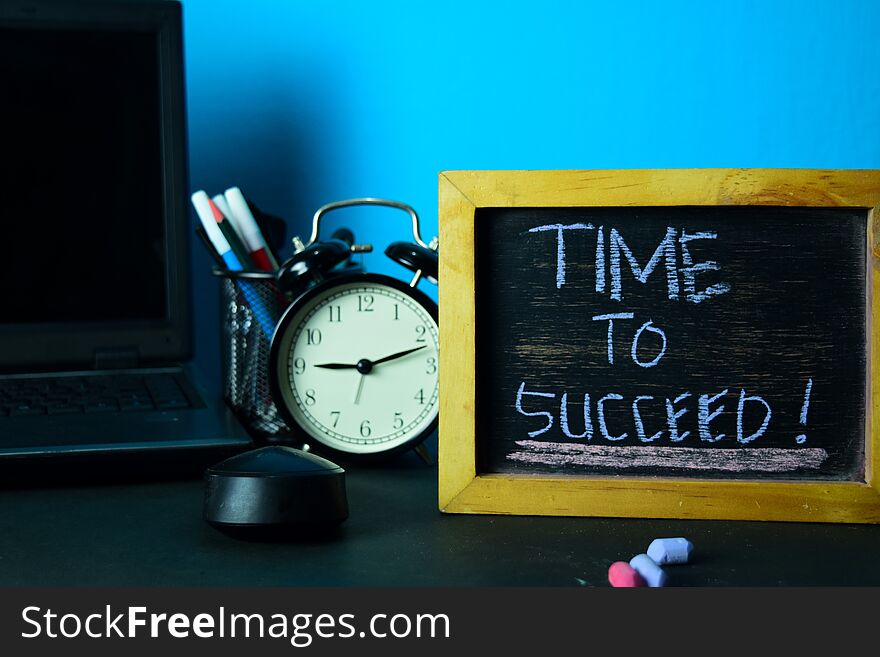 Time to Succeed! Planning on Background of Working Table with Office Supplies. Business Concept Planning on Blue Background