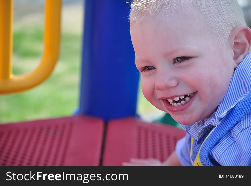 Smiling young boy in a park setting
