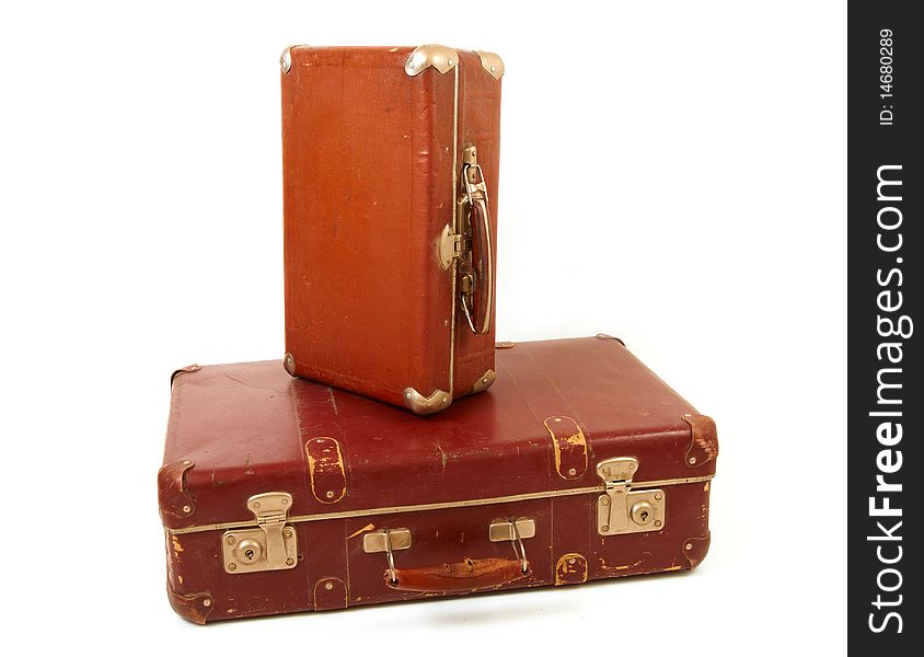 Two old suitcases for travel on white background