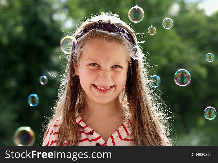 An image of a nice little girl with bubbles. An image of a nice little girl with bubbles