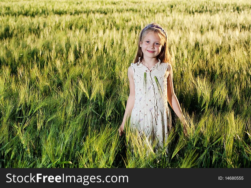 An image of a girl in the field of barley