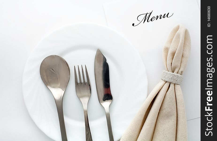 An image of fork, spoon and knife with napkin. An image of fork, spoon and knife with napkin