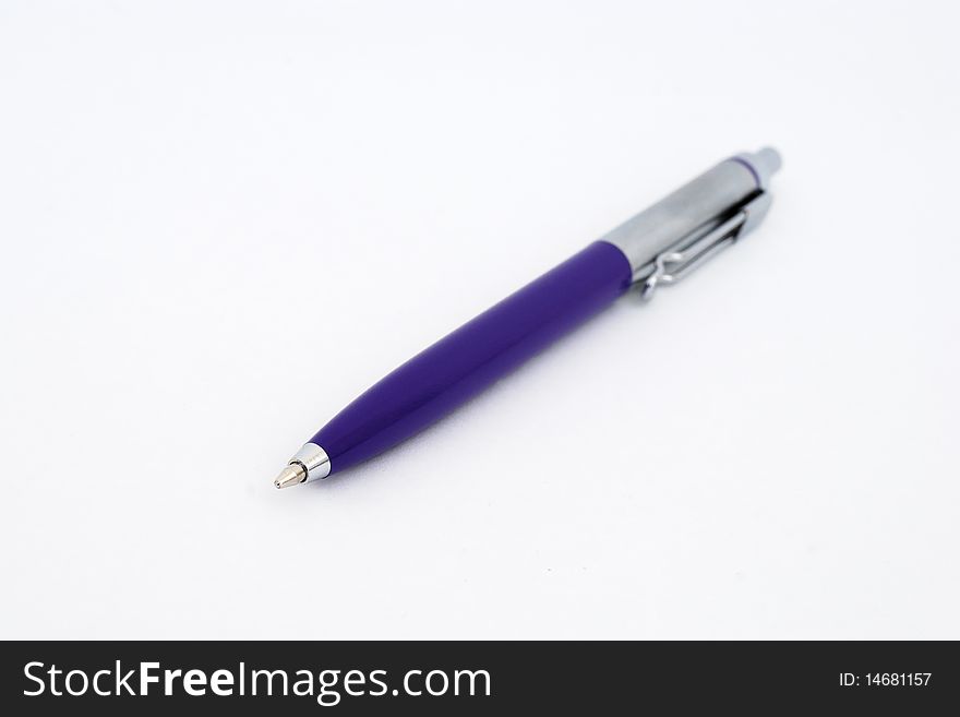 Close-up ballpoint pen. Focus on the tip, 
Isolated on white.