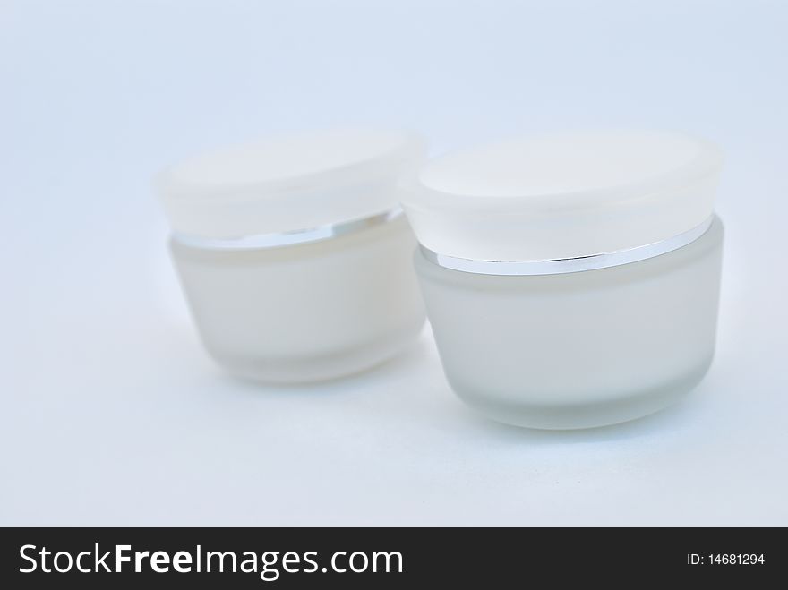 Containers of cosmetic face cream close-up. Containers of cosmetic face cream close-up