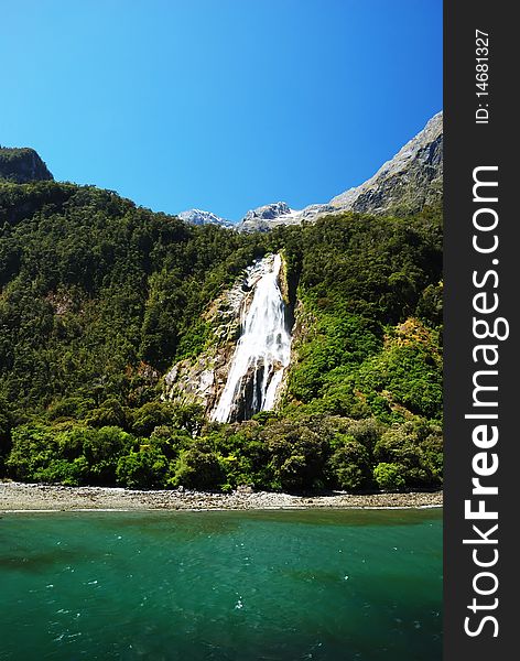 The great waterfall in Milford Sound, New Zealand