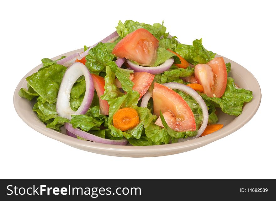 Tossed salad with lettuce, tomatoes, onions and carrots isolated on white