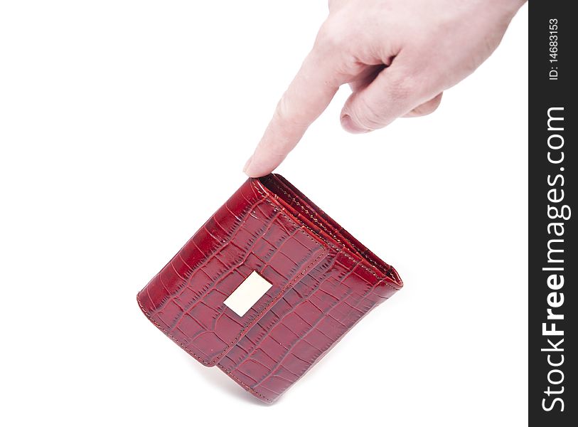 A hand holding a red purse over a white background