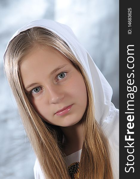 Portrait of long-haired girl in a white hood