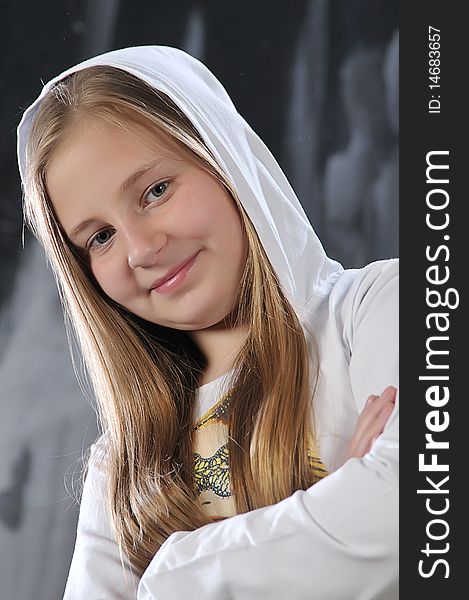 Portrait of long-haired girl in a white hood