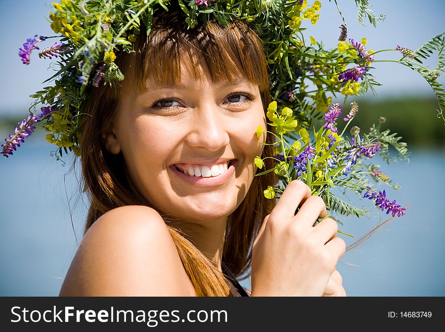 Pretty girl with floral wreath