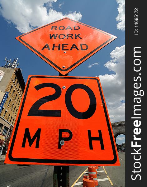 Sign indicating road work ahead and 20 mph speed limit. Sign indicating road work ahead and 20 mph speed limit.