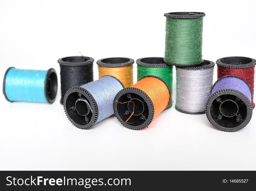 Colorful spools of thread in pile. Colorful spools of thread in pile.