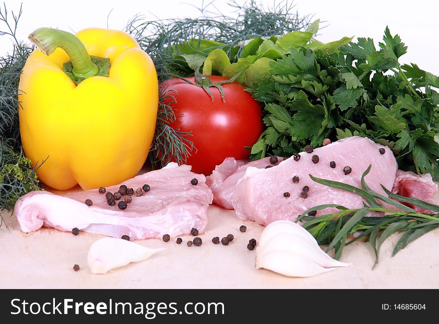 Fresh vegetables and pork isolated on a white background. Fresh vegetables and pork isolated on a white background