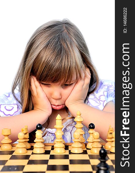 Little girls learn to play chess. Little girls learn to play chess