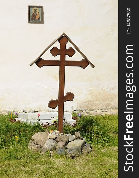 Cross at a temple wall, a tomb - the External Cathedral, Russia