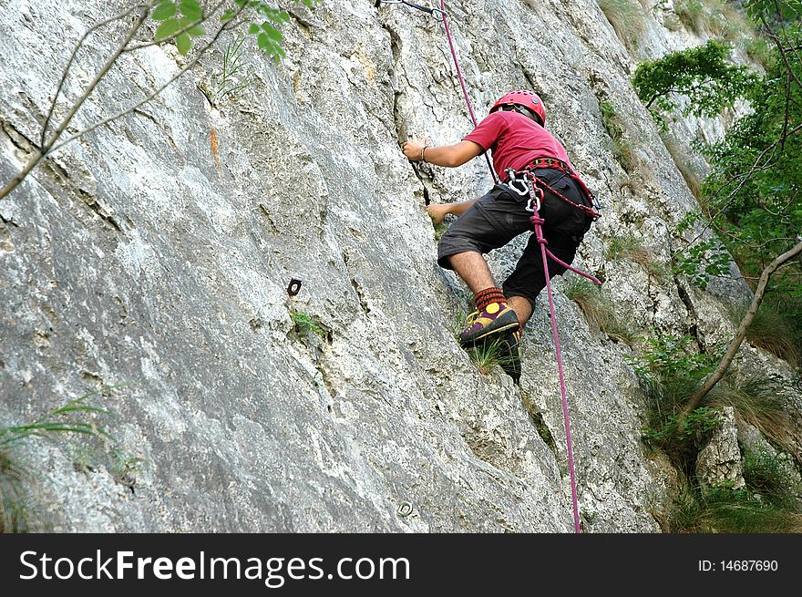 The climber try to touch the top of the route. The climber try to touch the top of the route.