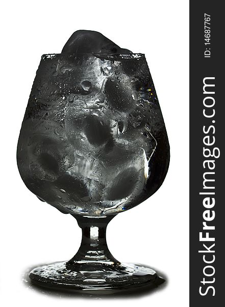 Inviting chilling footed tumbler with ice and drops in reversed color. Inviting chilling footed tumbler with ice and drops in reversed color