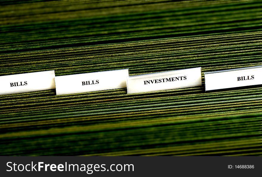 File tabs for investments and several blank file tabs. File tabs for investments and several blank file tabs