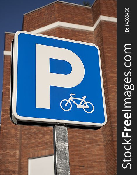 Blue bicycle sign in urban setting. Blue bicycle sign in urban setting