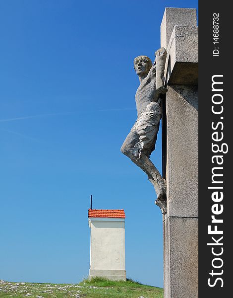 Crucified man with small chapel on top of the calvary in nitra, slovakia