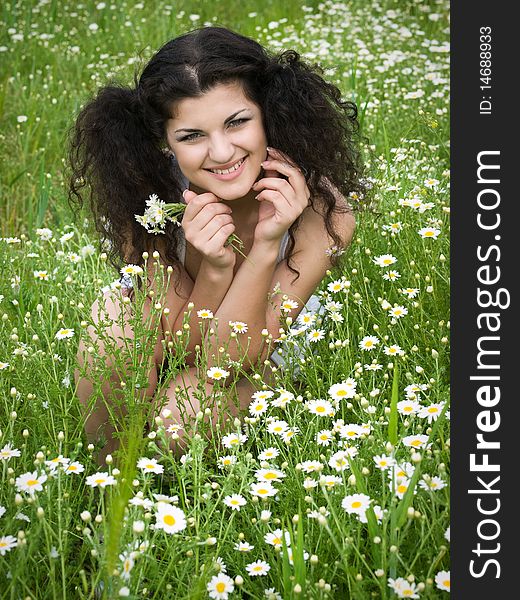 Young happy girl in daisy field. Young happy girl in daisy field
