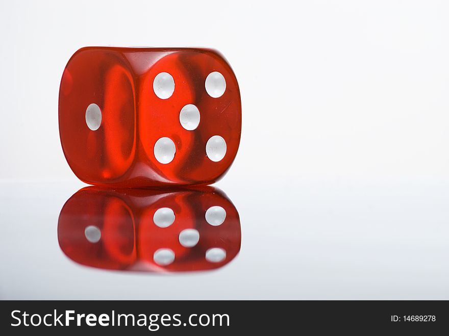 Red semi-translucent dice with reflection. Red semi-translucent dice with reflection