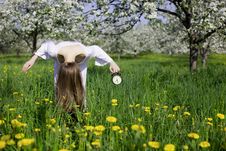 Young Girl With An Alarm Clock Near Blooming Apple Royalty Free Stock Photos Young Girl With An Alarm Clock Near Blooming Apple Royalty Free Stock Photos
