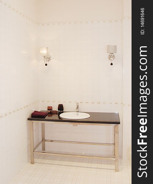 It is interior of apartment, it is a basin in the bathroom