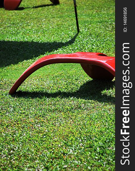 Red chair on green Grass.