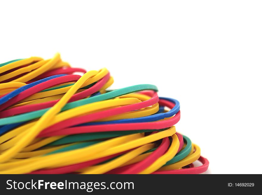 A pile of rubber bands on a white background