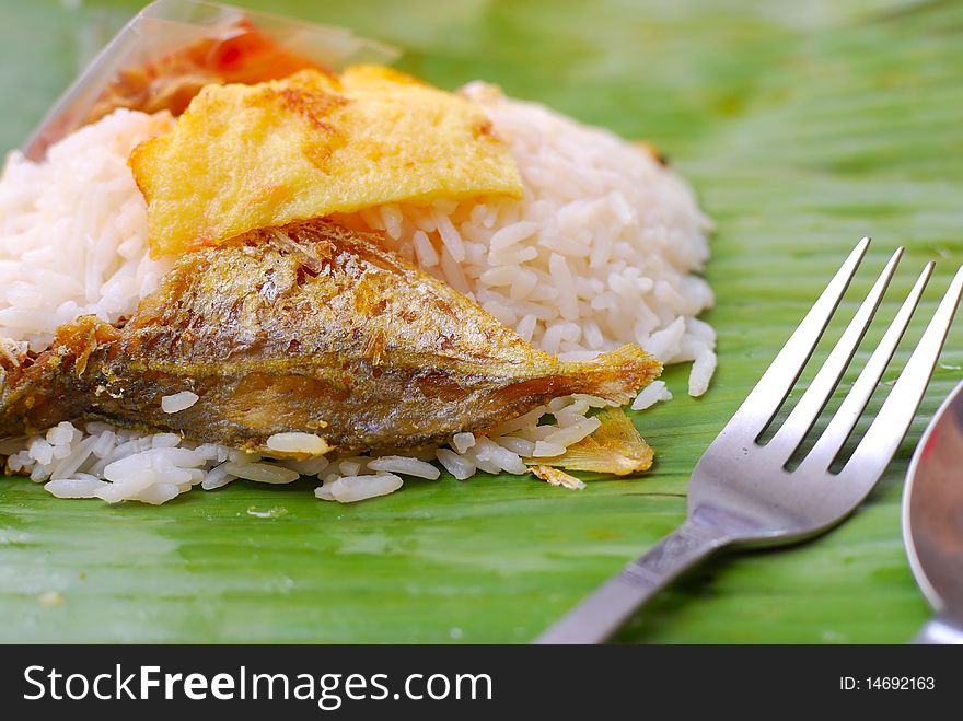 Malay traditional delicacy known as nasi briyani packed in banana leaf. Suitable for concepts such as diet and nutrition, healthy lifestyle, and food and beverage.