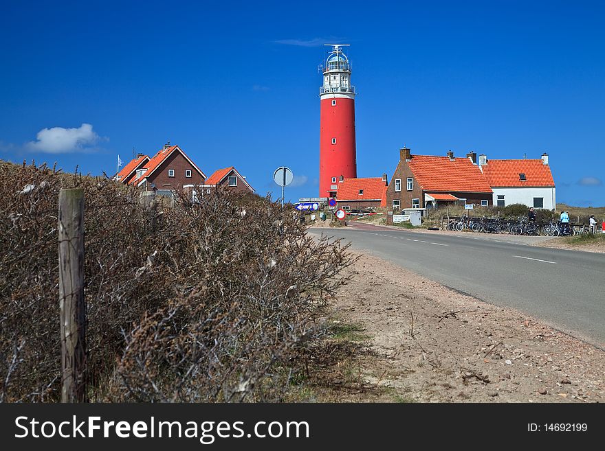 Lighthouse In The Dunes At The Beach