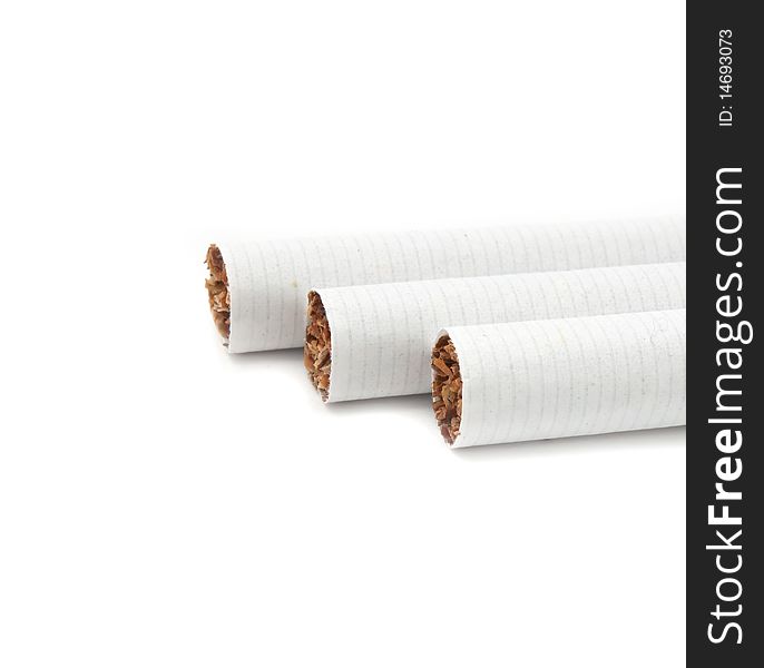 Unlit cigarette tips on a white background with copy space. Unlit cigarette tips on a white background with copy space