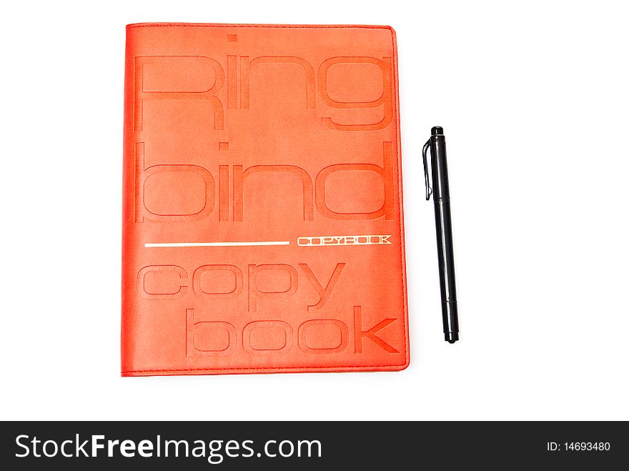 Red copybook and black pen isolated on white. Red copybook and black pen isolated on white