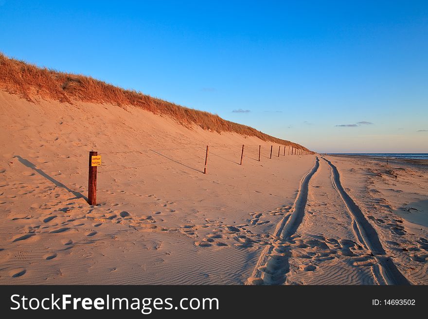 Beautiful Sunset At The Beach With Sand Dunes
