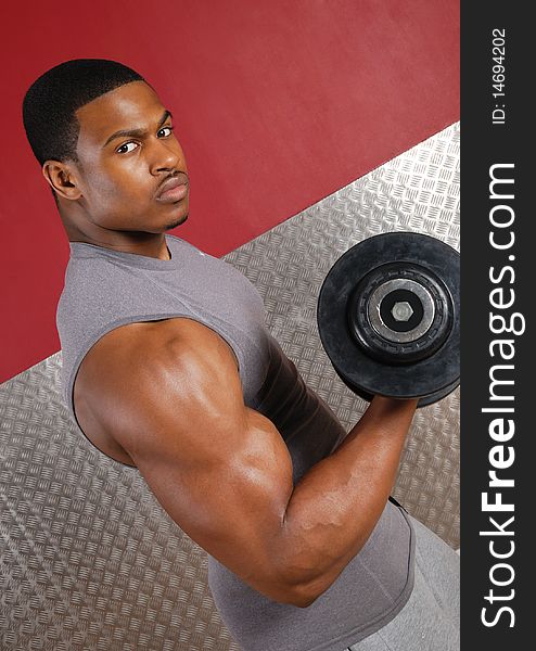 This is an image of a man lifting weights. This is an image of a man lifting weights.