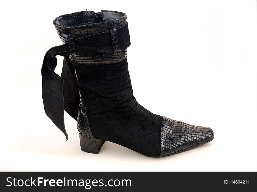 Black shine woman boot isolated over white