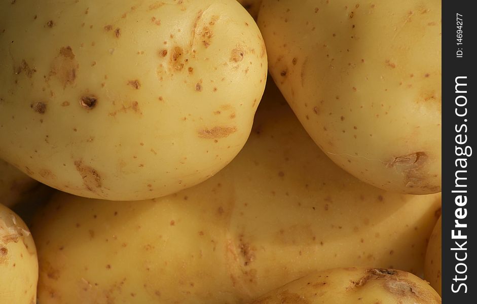 A close up of a pile of potatoes