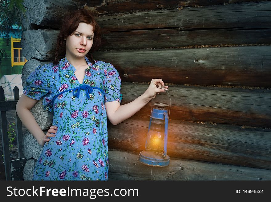 Beauty woman in vintage dress on wooden background