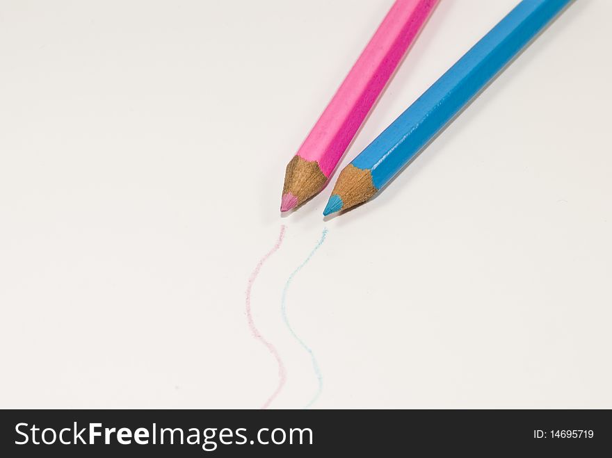 Two pens with different colors on gray background