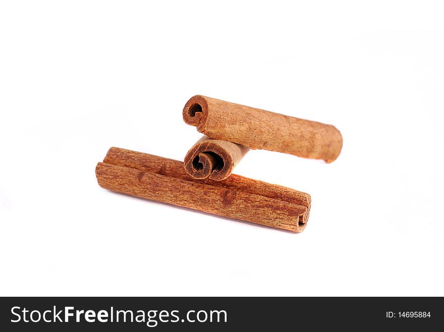 Two cinnamon sticks isolated on white background. Close up.
