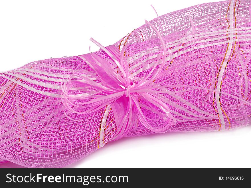 Pink grid for packing curtailed into a roll and tied by a bow