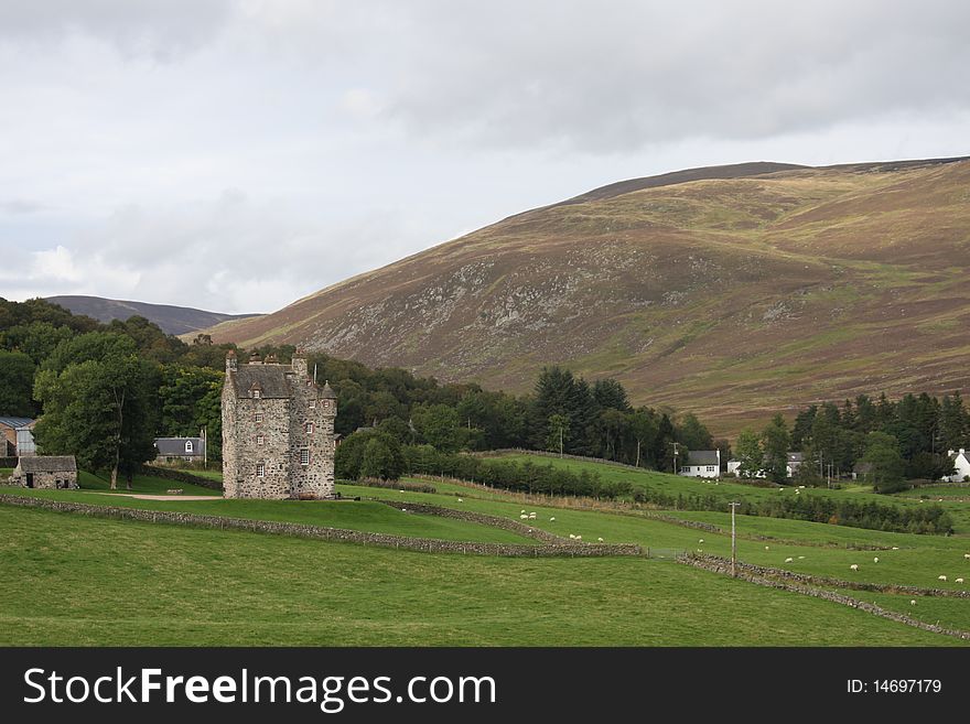 A Scottish castle on the hillside. A Scottish castle on the hillside