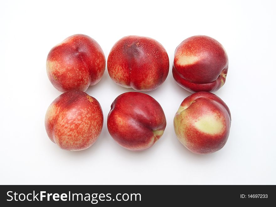 Six Peaches on a white background
