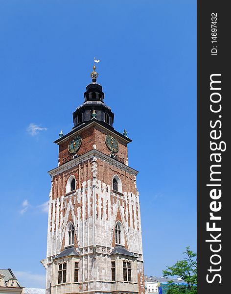 Town hall with clock in summer Krakow