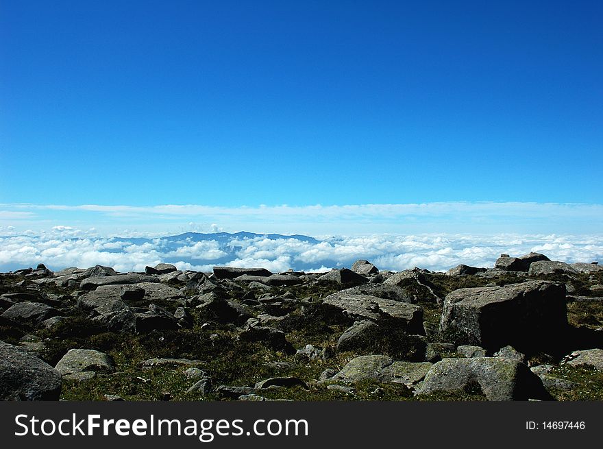 Mountains in the sea of clouds with blue sky in the morning
