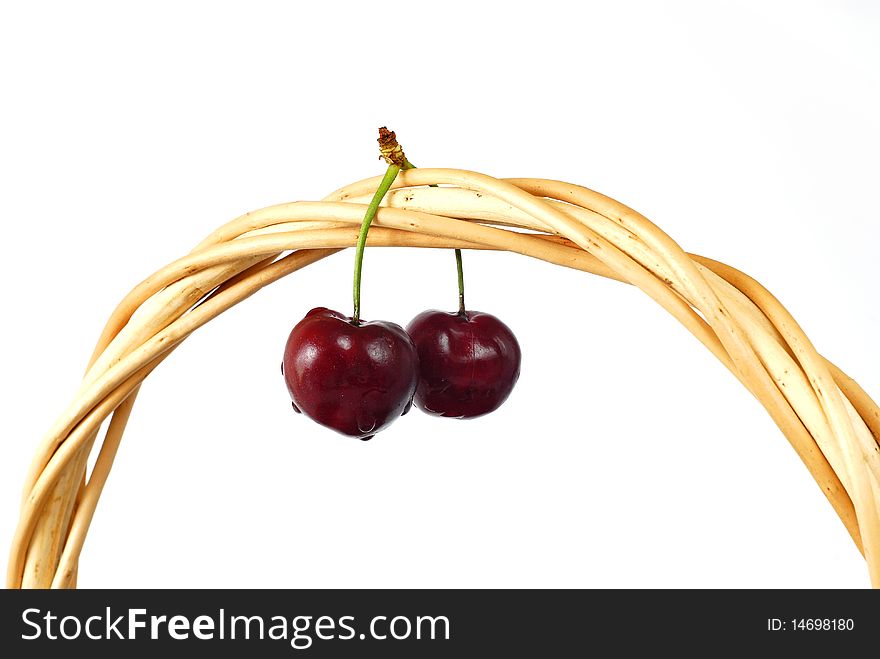 Twig with cherries made out on the white background. Twig with cherries made out on the white background