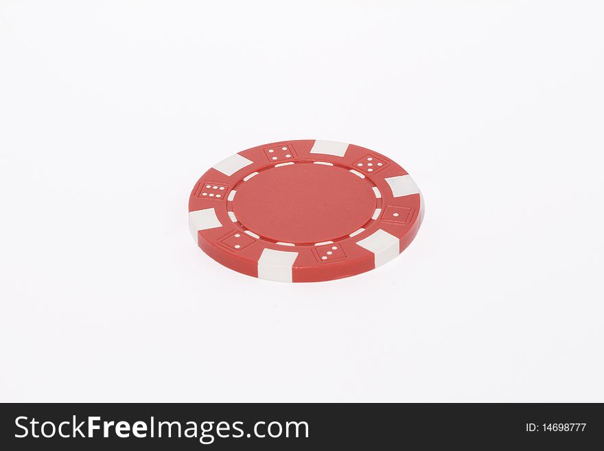 Isolated poker red chip in a white background taken with macro lens