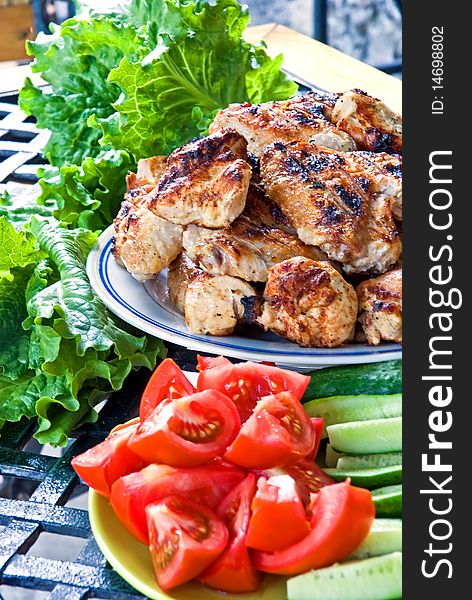 Grilled meat with vegetables on table. Grilled meat with vegetables on table