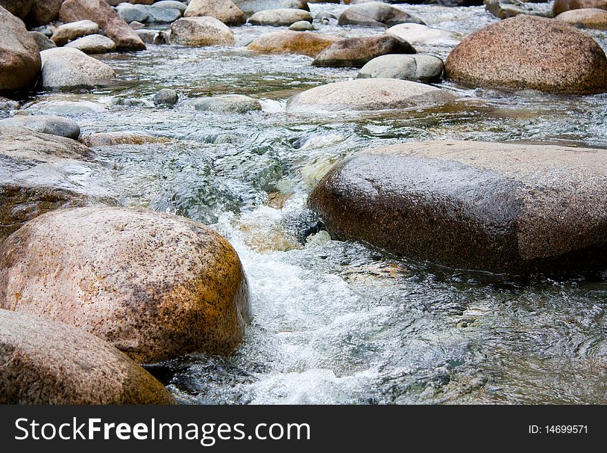 Stones in the water on the river.